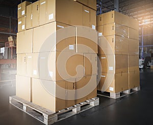 Stack of cardboard boxes on wooden pallet. package box, packaging. Manufactiring warehouse cargo shipment goods.