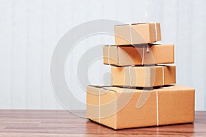 Stack of cardboard boxes on wooden table