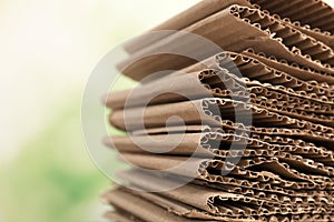 Stack of cardboard for recycling on blurred background