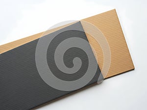 Stack of cardboard sheets in gray and beige