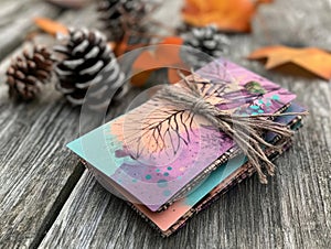 A stack of cards with a brown string tied to them