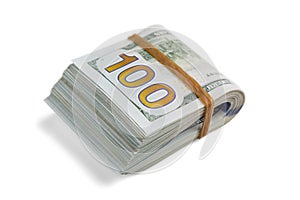 Stack of cash dollars, bent in half, under the elastic band is isolated on a white background. Close-up.