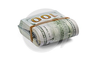 Stack of cash dollars, bent in half, under the elastic band is isolated on a white background. Close-up.