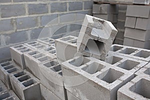 Stack of cement blocks at the construction site. cinder blocks background.
