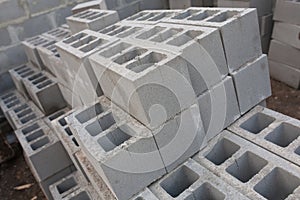 Stack of cement blocks at the construction site. cinder blocks background.
