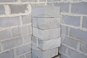 Stack of cement blocks at the construction site. cinder blocks background.