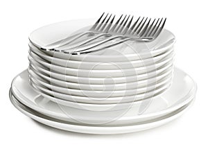 Stack of ceramic dishware with cutlery