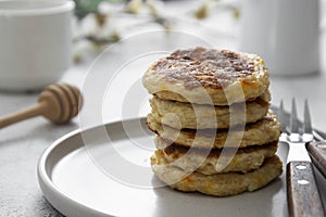 stack of cheese flapjacks. Rounf pancakes made from cotage cheese