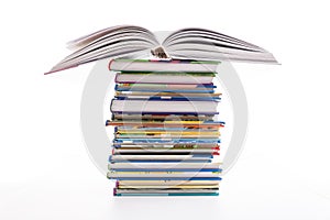 Stack of children`s books isolated on white