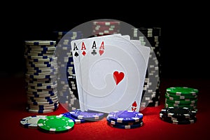 Stack of Chips with cards four aces