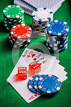 Stack of chips and cards on a table - poker game concept