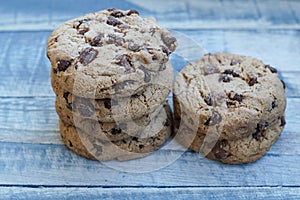 A stack of chocolate cookies on a wooden board