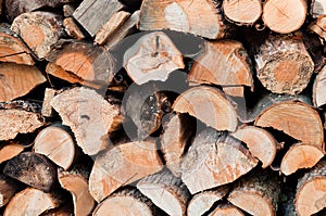 Stack of chopped firewoods prepared for winter