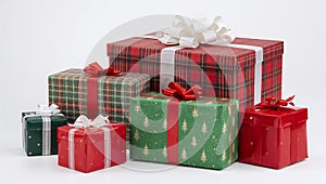 Stack of Christmas Gift Boxes Wrapped in Red and Green on White Background