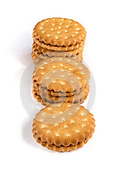 A stack of cicle biscuits puff sandwich cream isolated on white