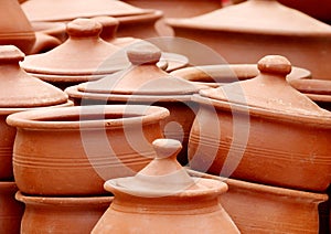 Stack of Clay Pots with Lids