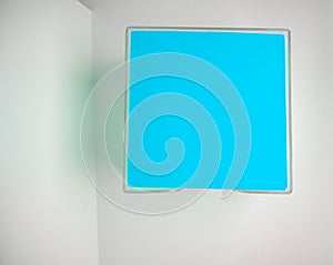 A stack of clean blue sheets of paper on a white background, top view. Layout