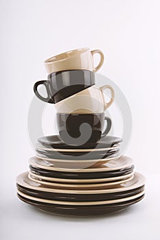 Stack of clean dishes in brown and beige