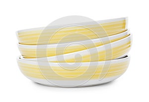 Stack of clean plates on white background