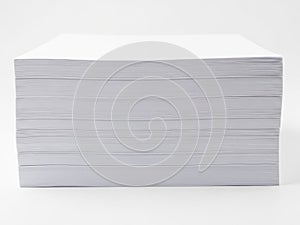 Stack of clean, white printer paper isolated on white background