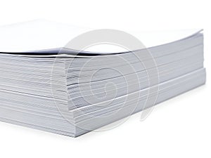 Stack of clean, white printer paper on white surface