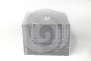 A stack of clear, slim CD or DVD disc cases