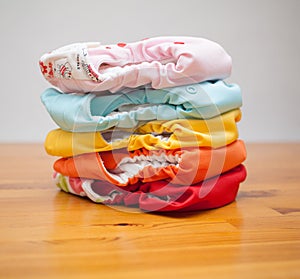 Stack of cloth diapers on a wooden table