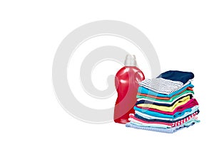 Stack of clothes and detergent bottle, fresh laundry textile