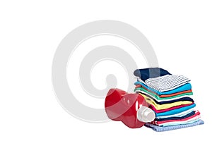 Stack of clothes and detergent bottle, fresh laundry textile