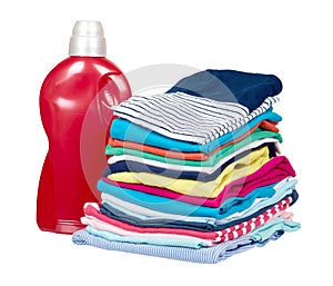 Stack of clothes and detergent bottle, fresh laundry textile