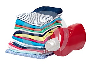Stack of clothes and detergent bottle, fresh laundry textile