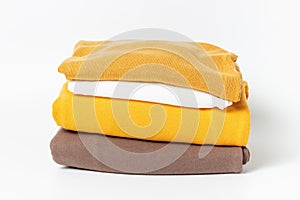 A stack of clothes isolated on white background close-up.