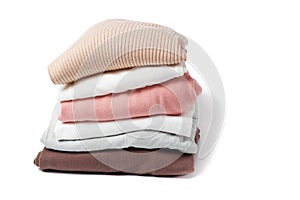 A stack of clothes isolated on white background close-up.