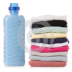 Stack of clothes Liquid powder conditioner fabric softener in hand