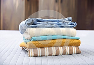 Stack of clothes. Pile of cotton garment.Folded clothing closeup