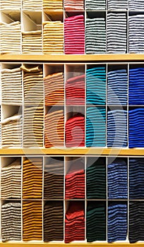 Stack of Clothes on a Shelf