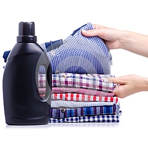 Stack clothes shirt with black bottle liquid laundry