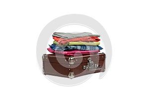 Stack of clothes on suitcase isolated on white background