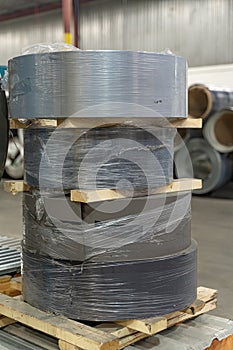 stack of Coil steel metal rolls in metal roofing factory