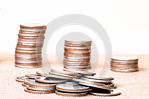 Stack coin and three pole range of coins on vintage blurred back