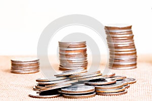 Stack coin and three pole range of coins on vintage blurred back