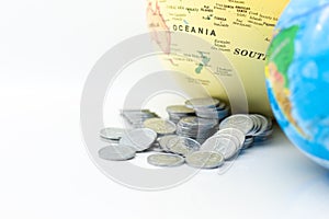 Stack of coin beside the world map. Image use for investment, business international concept