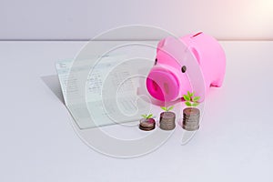 Stack of coins and account book bank on the table