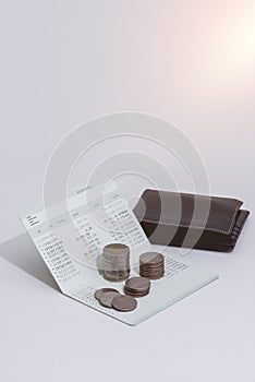 Stack of coins and account book bank on the table