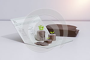 Stack of coins and account book bank on the table