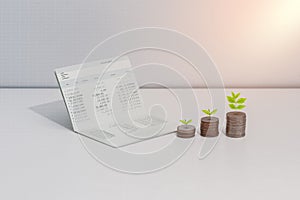 Stack of coins and account book bank on the table