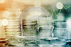Stack of coins with growing graph for business finance