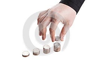 Stack of coins and human hand