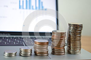 Stack coins on laptops