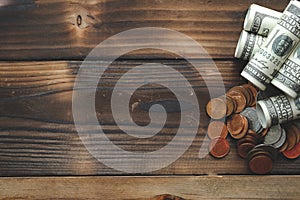 Stack of coins on old white wooden floor, ideas about saving money for future use